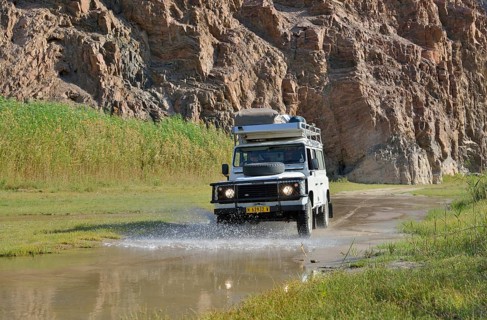 Safari vehicle in the Hoarusib river valley, Purros, Kaokoland, Kunene, Namibia, Africa