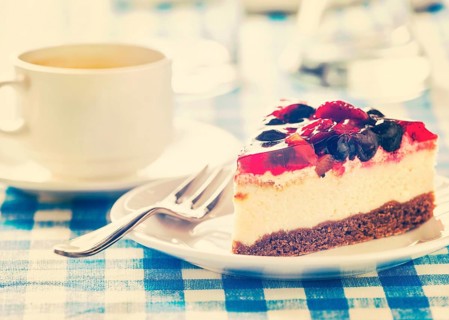 Vintage retro effect filtered hipster style image of dessert fruit cheese cake on plate with fork