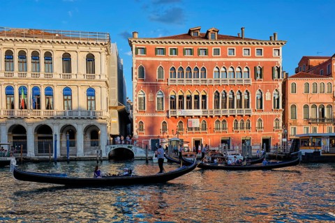 VENICE, ITALY, JUNE 27, 2018: Grand Canal with boats and gondolas on sunset, Venice, Italy, Europe