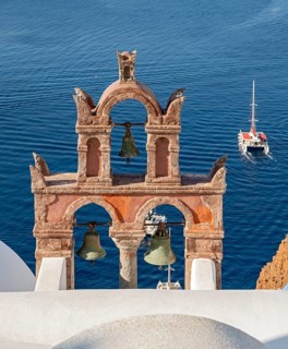 Old belfry wiith yacht and blue sea, Ia, Oia, Santorini, Greece, Europe