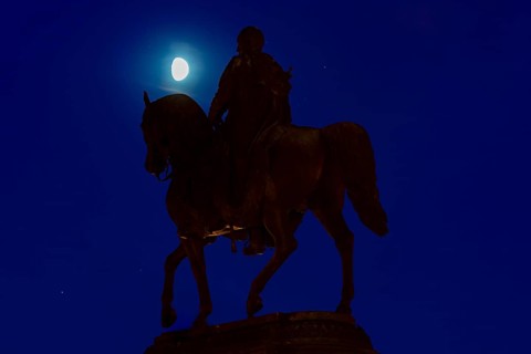Equestrian statue of King John of Saxony in the evening theatre square in front of the moon