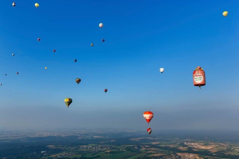 Many different hot air balloons in the blue sky, advertising, logo, hot air balloon festival, 26th