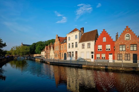 Typical Belgian cityscape Europe tourism concept, canal and old houses on sunset. Bruges (Brugge),
