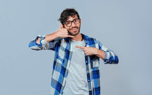 Interpreter man gesturing CALL ME in sign language. Person gesturing CALL ME in sign language,
