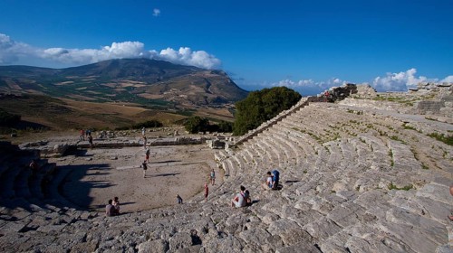 Evening light, Roman amphitheatre, few visitors in seats, Segesta, Ancient site, Archaeological