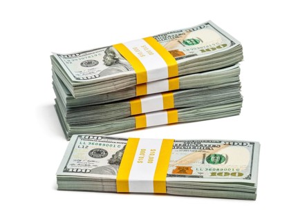 Creative business finance making money concept, stack of bundles of 100 US dollars 2013 edition