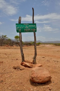 Sign at the entrance to the village of Omuramba, residential village of Chief Hikuminue Kapika, the