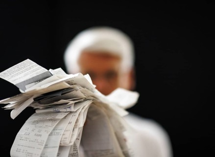 The subject of taxes. A man holds receipts in his hand in Berlin, 09/08/2024