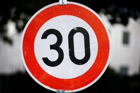 Symbol photo on the subject of speed limit 30 km/h. Close-up of a traffic sign with a 30. Berlin,