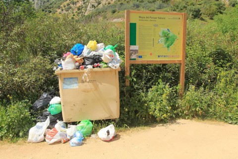 Overflowing rubbish bin at natural park, Cueva del Gato, Benaojan, Serrania de Ronda, Malaga