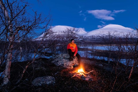 Man at the campfire, Stora Sjöfallet National Park, World Heritage Laponia, Norrbotten, Lapland,