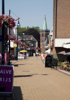 Almost deserted main shopping street at noon on very hot summer day, Sliedrecht, Netherlands