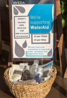 Aveda Corporation raffle supporting Water Aid charity shop window display, High Street,