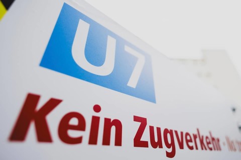 A sign indicates the suspension of train services on the underground line 7 in Berlin, 27 February