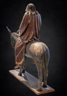 Palm tree donkey, wooden figure from around 1520, on a dark background, Diocesan Museum,