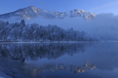 Mountains reflected in lake, winter, snow, evening light, Lake Kochel, foothills of the Alps,