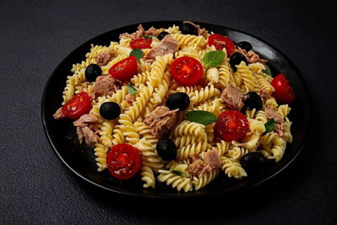 Tuna salad, fusilli pasta, olives and cherry, olive oil, homemade