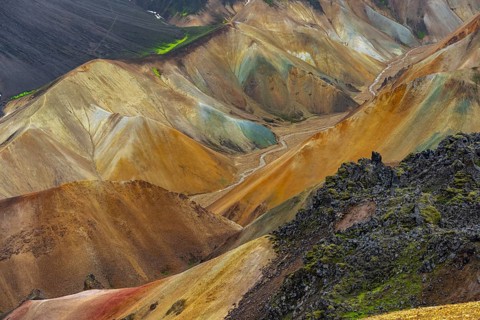 Small river between colourful rhyolite mountains, volcanic landscape, erosion landscape, view from