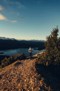 Trail running in autumn on the Jochberg on Lake Walchensee against the wonderful backdrop of the