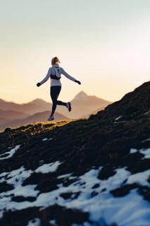 Trail running in autumn on the Jochberg on Lake Walchensee against the wonderful backdrop of the
