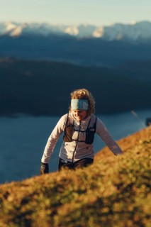 Trail running in autumn on the Jochberg on Lake Walchensee against the wonderful backdrop of the