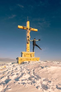 Summit bliss in the snow-covered winter landscape in the Tannheimer Tal in the Alps on the