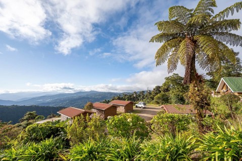Lodge in the cloud forest, in the evening light, Quetzal Lodge, view over mountain landscape, San