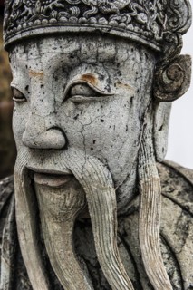 Stone sculpture in Wat Pho temple, head, face, weathered, Buddhism, religion, world religion,