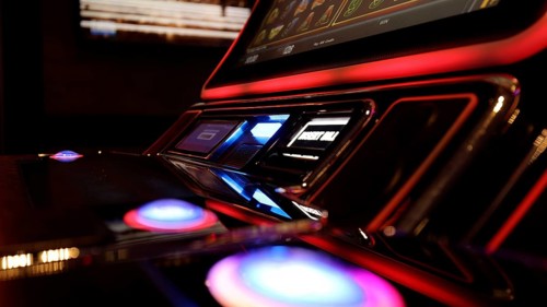 Person gambling on casino blackjack and slot machines on a cruise vacation