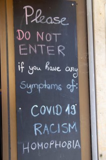 Display in front of a pub in Germany: Guests are warned in English that they are not welcome with