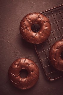 Donuts with cocoa, in chocolate glaze, top view, no people