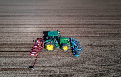 Sugar beet being sown in spring, precision sowing with precision seed drill, behind a tractor,