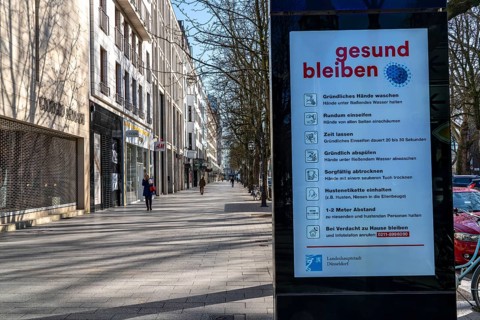 Advertising displays, on Königsallee, Kö, give advice on correct behaviour, empty city centre,