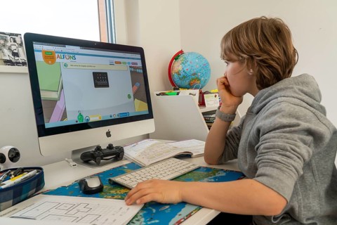 Young, primary school pupils, home learning, doing schoolwork, distance learning, virtual