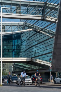 Cyclists on the cycle path on Christians Brygge Street, at the Black Diamond, Danish Royal Library,
