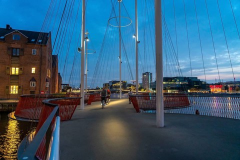Cyclists on the Cirkelbroen cycle and pedestrian bridge, over the harbour, in the Christianshavens