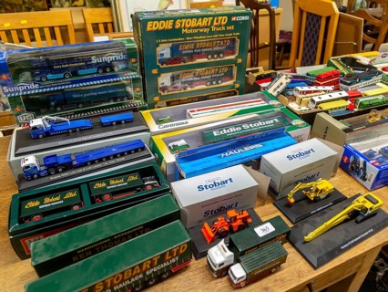 Boxes of Eddie Stobart model trucks and other vehicles on display at auction, UK