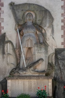 Sculpture of St George with the dragon on a war memorial from both world wars, 1914 to 1918 and