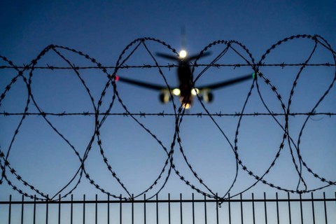 Symbolic image security at the airport, outer fence at Düsseldorf International Airport, steel wire