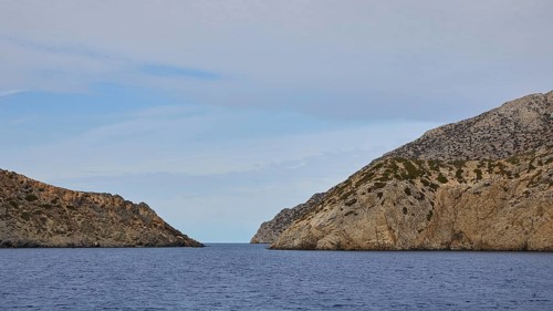 Natural passageway between two steep cliffs overlooking the vast sea, Saria boat tour, Saria