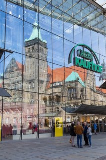 New town hall reflected in the glass façade of Galerie Kaufhof, Markt, Chemnitz, Saxony, Germany,