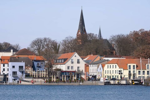 Town view at Lake Malchow with town harbour and town church, Malchow, island town, Mecklenburg Lake