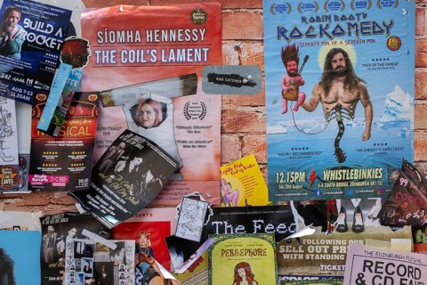 Posters and advertising cards on a wall, world's largest cultural festival The Fringe, High Street,