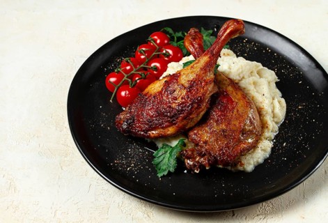Fried duck shank, cauliflower puree, cherry tomatoes, homemade, no people