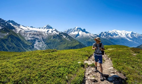 Mountaineer in front of mountain panorama with glaciated mountain peaks, Aiguille de Chardonnet