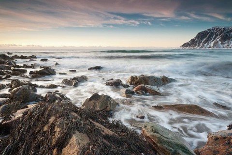 Long exposure, winter evening mood at Skagsanden, stones on the beach at Flakstad, Flakstadøy,
