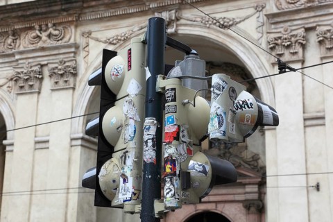 The back of a traffic light was covered with stickers, Prague, Czech Republic, Europe