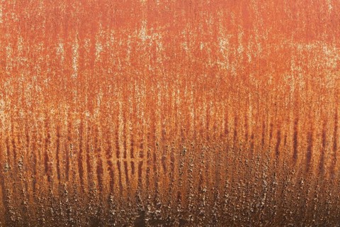 Close-up of cylindrical metal surface with rust stains and streaks, Quebec, Canada, North America