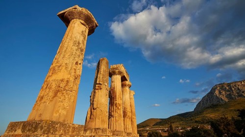 Archaic Temple of Apollo, Doric Columns, Ruins of ancient columns against a vivid blue sky with