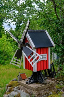 Model of a typical Swedish red windmill in a garden in Blekinge, Sweden, Europe